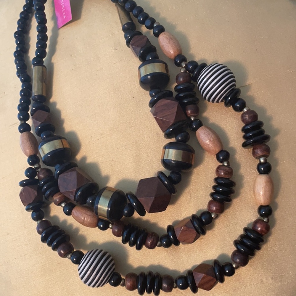 Wooden necklace 24” long. Made in India.